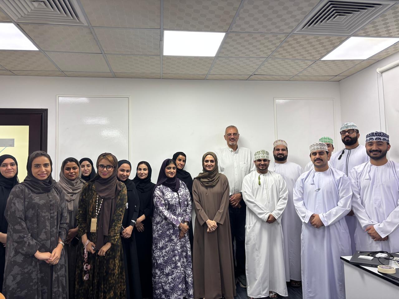 Sherif with training participants in Oman
